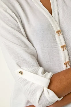 Roman Ivory Longline Bow Button Top