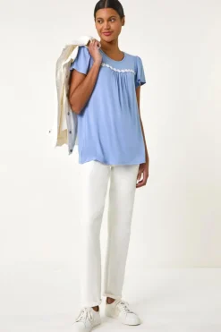 Roman Light Blue Daisy Trim Stretch Top