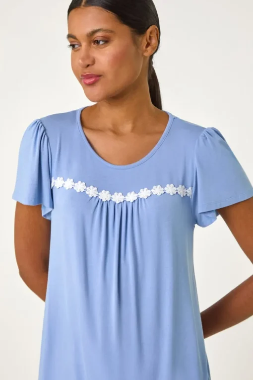 Roman Light Blue Daisy Trim Stretch Top
